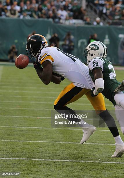 Wide Receiver Martavis Bryant of the Pittsburgh Steelers has a pass broken up by Cornerback Phillip Adams of the New York Jets at MetLife Stadium on...