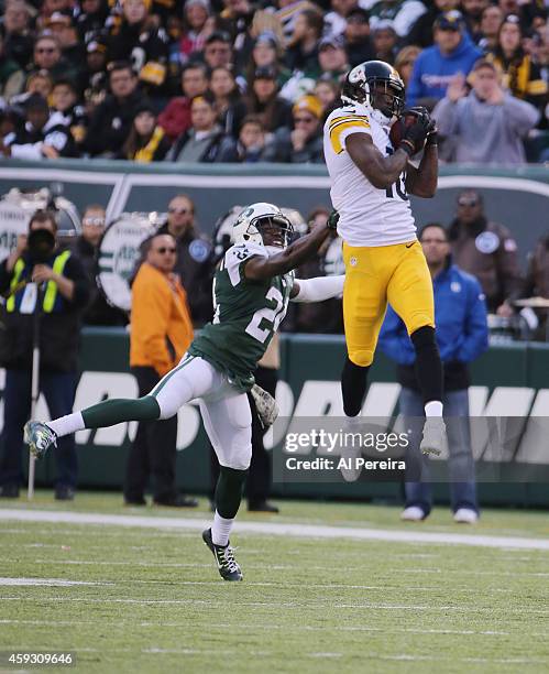 Wide Receiver Martavis Bryant of the Pittsburgh Steelers has a long gain in front of Cornerback Phillip Adams of the New York Jets at MetLife Stadium...