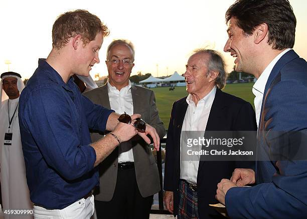 Prince Harry, Philip Green, Sir Jackie Stewart and Arnaud Boetsch, Communication & Image Director of Rolex, attend the Sentebale Polo Cup presented...