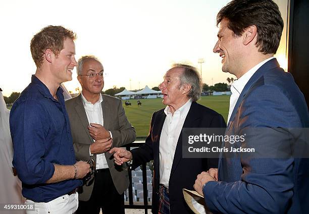 Prince Harry, Philip Green, Sir Jackie Stewart and Arnaud Boetsch, Communication & Image Director of Rolex, attend the Sentebale Polo Cup presented...