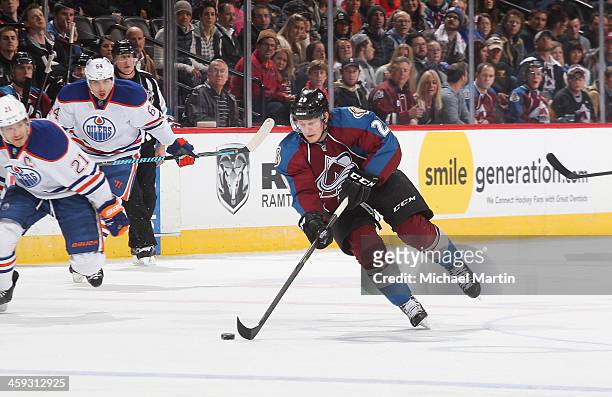 Nathan MacKinnon of the Colorado Avalanche skates against the Edmonton Oilers at the Pepsi Center on December 19, 2013 in Denver, Colorado. The...