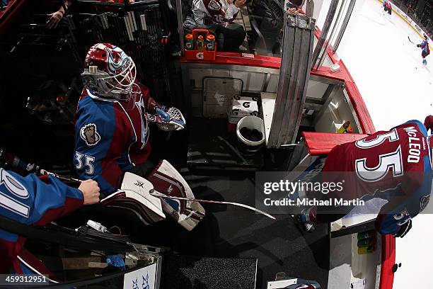Goaltender Jean-Sebastien Giguere of the Colorado Avalanche follows teammate Cody McLeod as they take the ice prior to the game against the Edmonton...