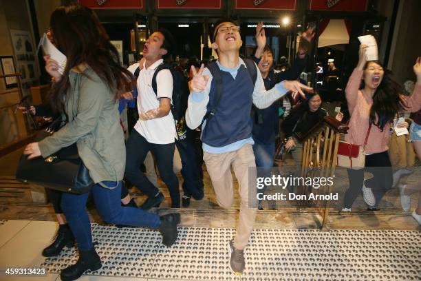 Customers enter the the David Jones city store in the early hours of the morning at the start of Boxing Day sales on December 26, 2013 in Sydney,...