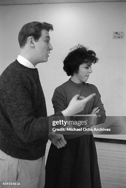 Comedy team Mike Nichols And Elaine May pose for a portrait in a bowling alley on February 4, 1961 in New York City, New York.