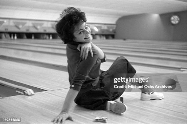 Comedian Elaine May poses for a portrait in a bowling alley on February 4, 1961 in New York City, New York.