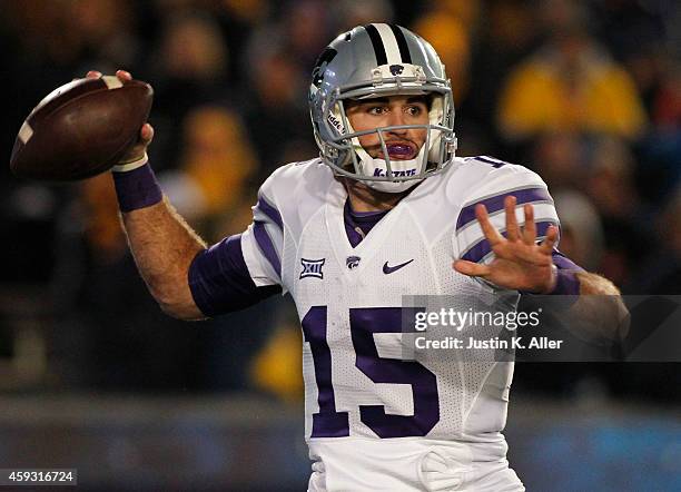 Jake Waters of the Kansas State Wildcats drops back to pass in the first half against the West Virginia Mountaineers during the game on November 20,...