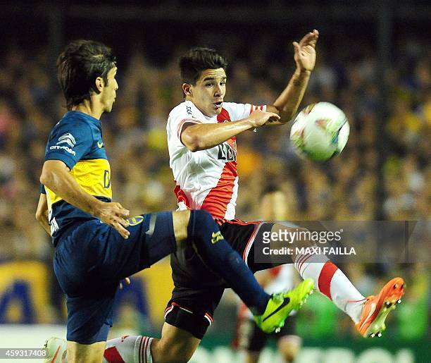 River Plate's forward Giovanni Simeone vies for the ball with Boca Juniors' defender Juan Forlin during a Copa Sudamericana semifinal football match...