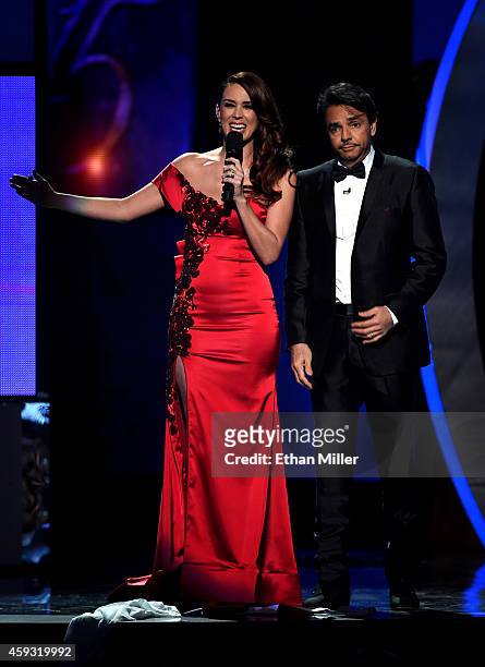Co-hosts Jacqueline Bracamontes and Eugenio Derbez speak onstage during the 15th Annual Latin GRAMMY Awards at the MGM Grand Garden Arena on November...