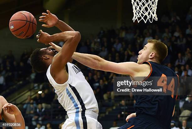 Darrun Hilliard II of the Villanova Wildcats is fouled by Ben Oberfeld of the Bucknell Bison at The Pavilion on November 20, 2014 in Villanova,...