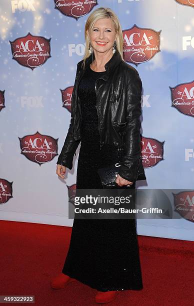 Singer/actress Olivia Newton-John arrives arrives at the American Country Awards 2013 at the Mandalay Bay Events Center on December 10, 2013 in Las...