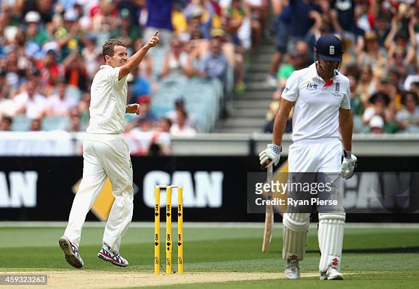 Peter Siddle of Australia celebrates after taking the wicket of Alastair Cook of England during day one of the Fourth Ashes Test Match between...