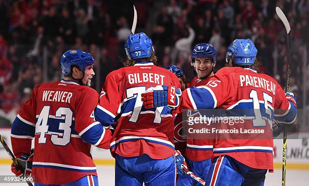 Max Pacioretty of the Montreal Canadiens celebrates with teammates after scoring a goal against of the St Louis Blues in the NHL game at the Bell...