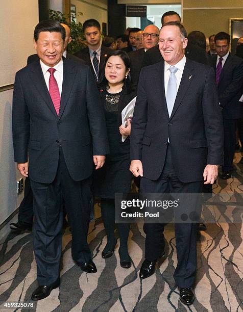 Chinese President Xi Jinping and New Zealand Prime Minister John Key chat before the launching ceremony of New Zealand-China Mayoral Forum at SkyCity...