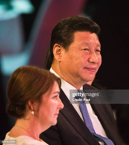 New Zealand Prime Minister's wife Bronagh Key and Chinese President Xi Jinping raise their wine glass during a luncheon at SkyCity Grand Hotel on...