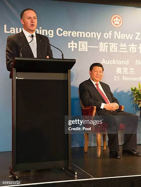 New Zealand Prime Minister John Key and Chinese President Xi Jinping address Mayors from local councils around the country during the Launching...