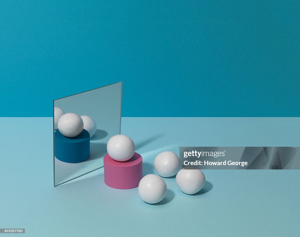 White Balls on Coloured Plinths