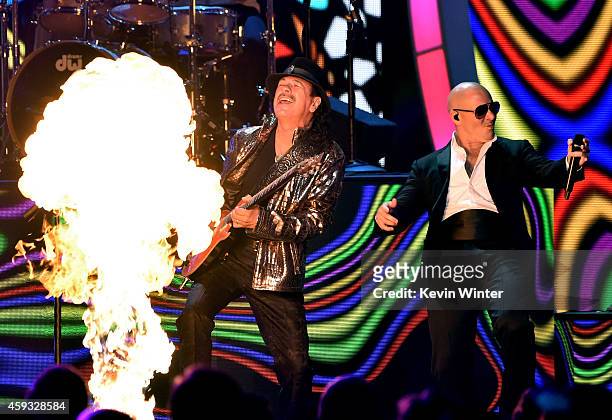 Recording artists Carlos Santana and Pitbull perform onstage during the 15th annual Latin GRAMMY Awards at the MGM Grand Garden Arena on November 20,...