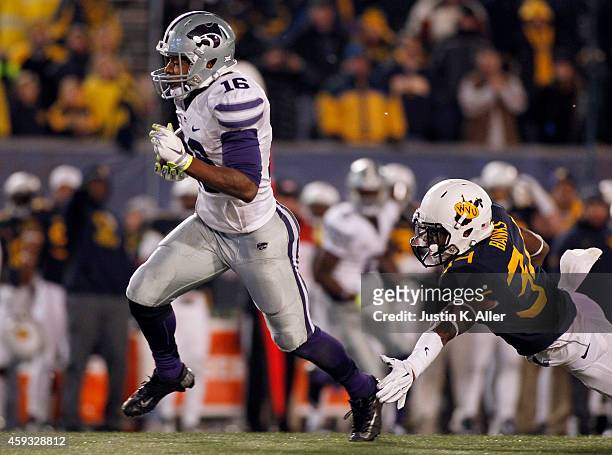 Ishmael Banks of the West Virginia Mountaineers makes a shoe string tackle in the fourth quarter on Tyler Lockett of the Kansas State Wildcats during...