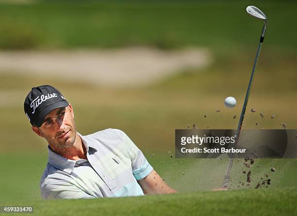 Geoff Ogilvy of Australia plays a shot out of a bunker on the 7th hole during day two of the Australian Masters at The Metropolitan Golf Course on...