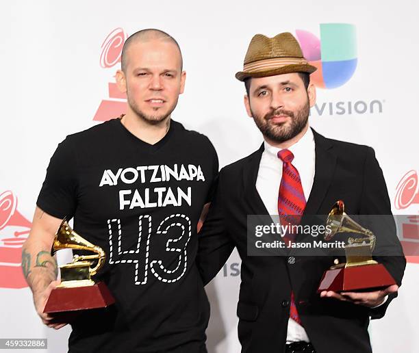 Recording artists Residente Calle 13 and Visitante of music group Calle 13, winners of Best Alternative Song, attend the 15th Annual Latin GRAMMY...