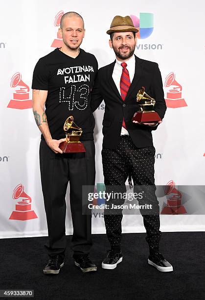 Recording artists Residente Calle 13 and Visitante of music group Calle 13, winners of Best Alternative Song, attend the 15th Annual Latin GRAMMY...