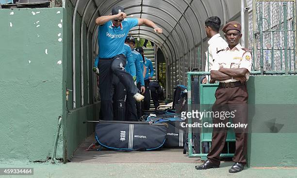 England captain Alastair Cook jumps over a kit bag as he leads out his team ahead of the tour match between between Sri Lanka A and England at...