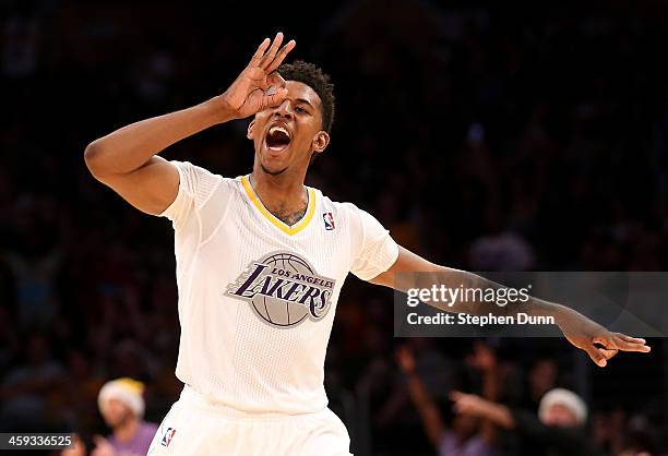 Nick Young of the Los Angeles Lakers celebrates after making a three point basket against the Miami Heat at Staples Center on December 25, 2013 in...