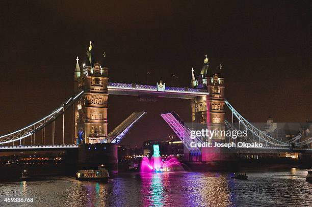 Candy Crush gummy bear cruises down the Thames underneath Tower Bridge for the Launch of Candy Crush Soda on November 20, 2014 in London, England.