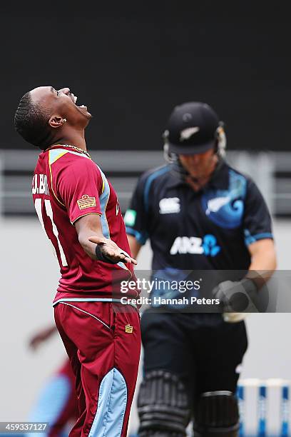 Dwayne Bravo of the West Indies celebrates the wicket of Corey Anderson of New Zealand during the first One Day International match between New...
