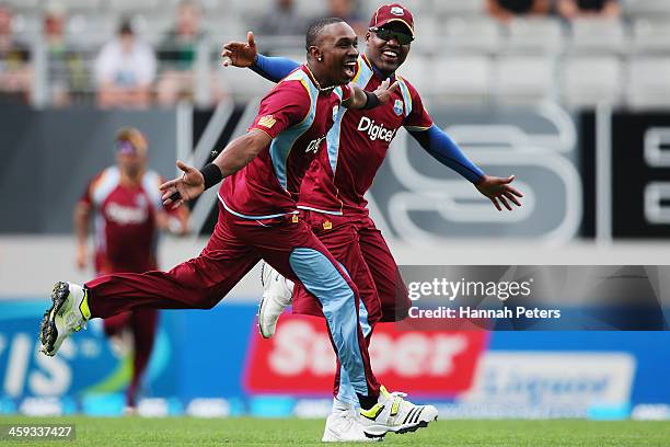 Dwayne Bravo of the West Indies celebrates a lbw decision which was later overturned with Darren Bravo during the first One Day International match...