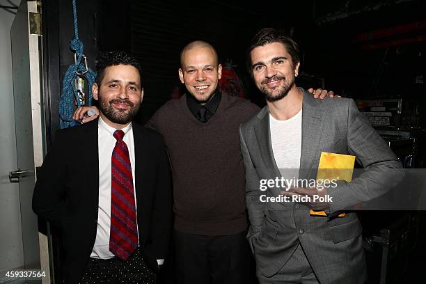 Recording artist Juanes poses with the Best Pop/Rock Album award for 'Loco de Amor' backstage with recording artists Visitante and Residente of music...