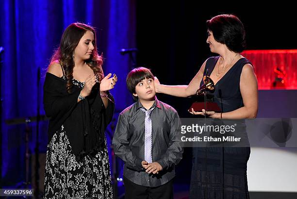 Guests accept Album of the Year award for 'Cancion de Andaluza' on behalf of Paco de Lucia onstage during the 15th annual Latin GRAMMY Awards...