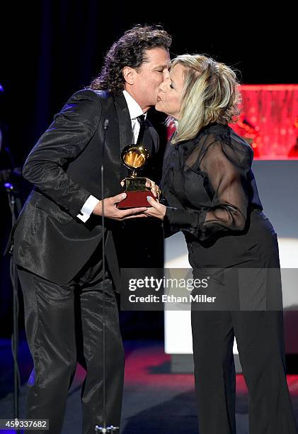 Singer/songwriter Carlos Vives accepts the award for Best Tropical Song onstage during the 15th annual Latin GRAMMY Awards premiere ceremony at the...