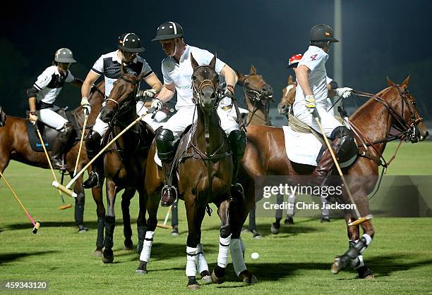 Prince Harry plays during the Sentebale Polo Cup presented by Royal Salute World Polo at Ghantoot Polo Club on November 20, 2014 in Abu Dhabi, United...