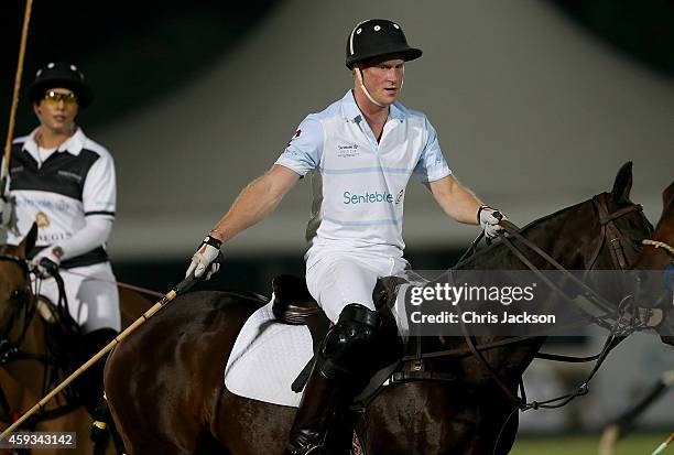 Prince Harry plays during the Sentebale Polo Cup presented by Royal Salute World Polo at Ghantoot Polo Club on November 20, 2014 in Abu Dhabi, United...