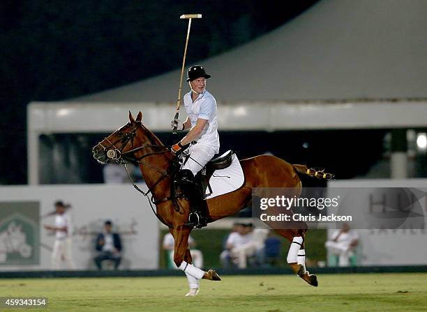 Prince Harry plays during the Sentebale Polo Cup presented by Royal Salute World Polo at Ghantoot Polo Club on November 20, 2014 in Abu Dhabi, United...