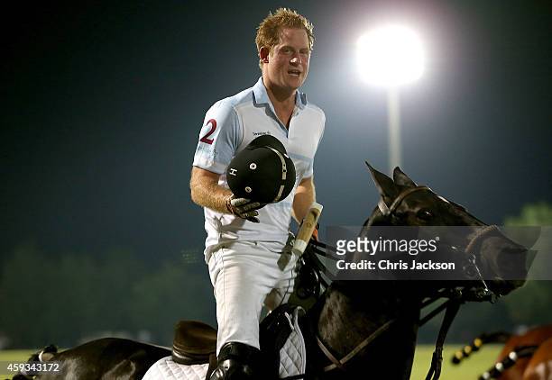 Prince Harry plays during the Sentebale Polo Cup presented by Royal Salute World Polo at Ghantoot Polo Club on November 20, 2014 in Abu Dhabi, United...