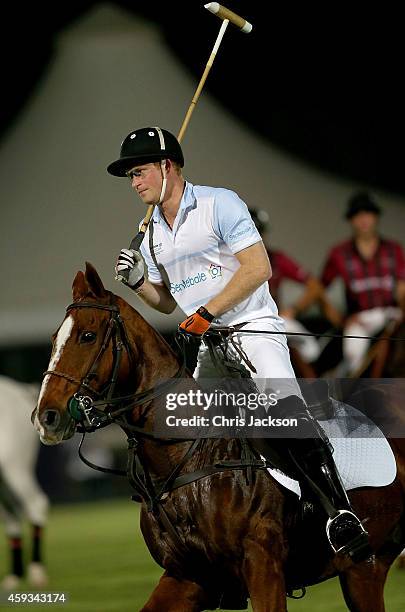 Prince Harry plays during the Sentebale Polo Cup presented by Royal Salute World Polo at Ghantoot Polo Club on November 20, 2014 in Abu Dhabi, United...