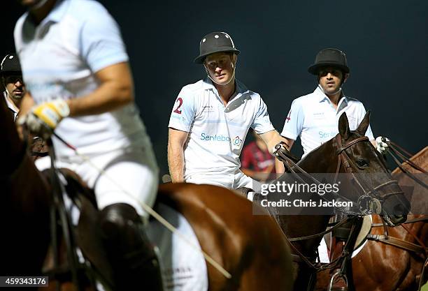 Prince Harry plays during the Sentebale Polo Cup presented by Royal Salute World Polo at Ghantoot Polo Club on November 20, 2014 in Abu Dhabi, United...