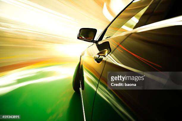 a speeding car with blurred lights - car racing blurred motion stock pictures, royalty-free photos & images