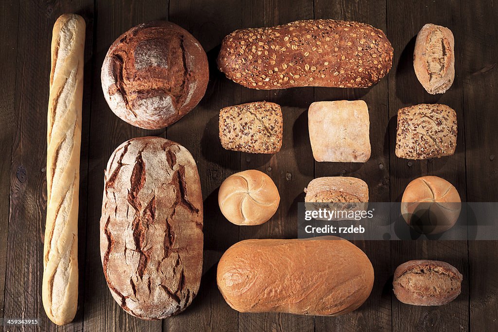 Bread and buns on wooden table, Bakeries