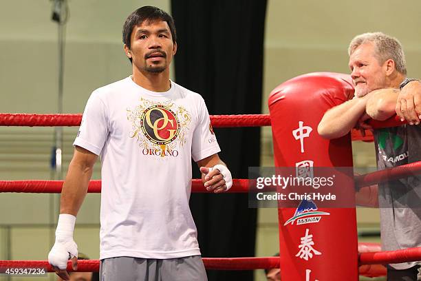 Manny Pacquiao trains while trainer Freddie Roach looks on during a workout session at The Venetianon November 21, 2014 in Macau, Macau.