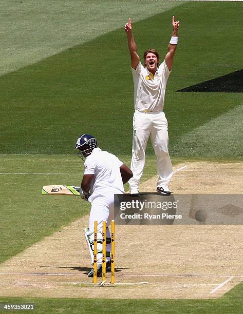 Shane Watson of Australia celebrates after taking the wicket of Michael Carberry of England during day one of the Fourth Ashes Test Match between...