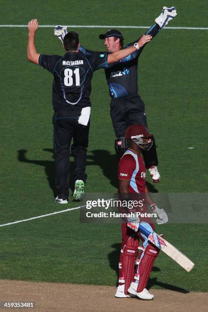 Darren Bravo of the West Indies walks off after being dismissed by Mitchell McClenaghan of New Zealand during the first One Day International match...