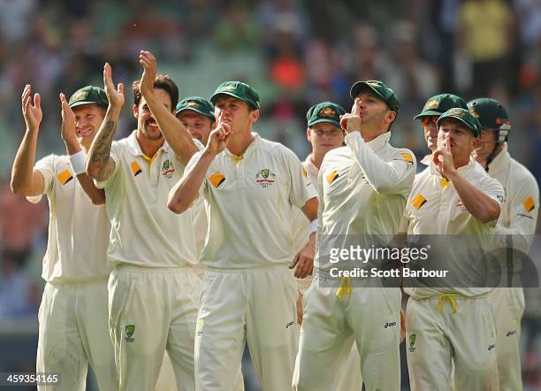 Peter Siddle, Michael Clarke and David Warner gesture towards the Bramy Army after Mitchell Johnson of Australia dismissed Jonny Bairstow of England...