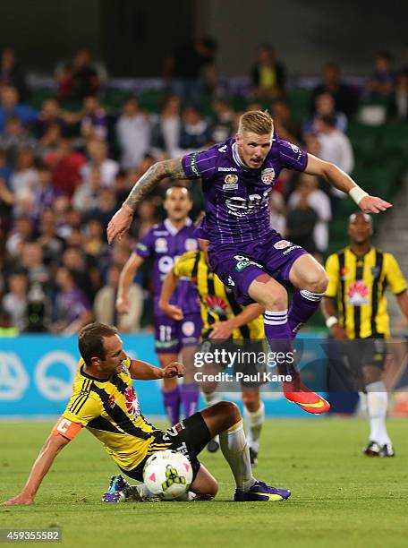Andrew Durante of the Phoenix and Andy Keogh of the Glory challenge for the ball during the round seven A-League match between Perth Glory and...