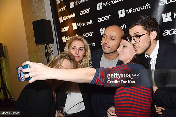 Eric judor and guests pose for a selfie during the Acer Pop Up Store Launch Party at Les Halles on November 20, 2014 in Paris, France.