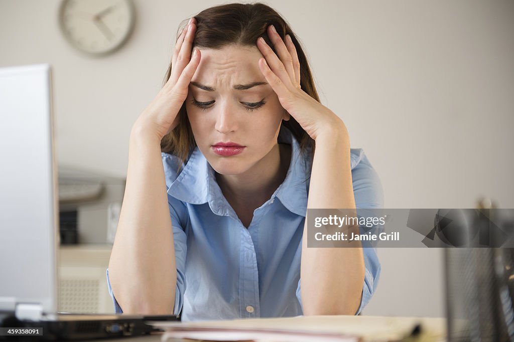 Businesswoman frustrated at work