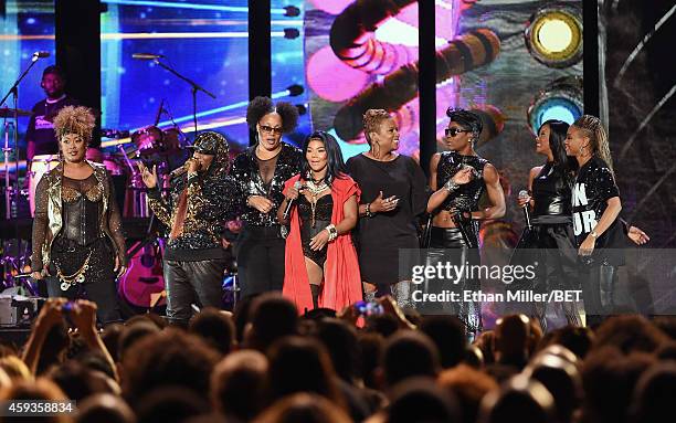 Rappers Da Brat , Missy Elliott and Lil' Kim , singers Pam Long and Kima Dyson of Total and rapper MC Lyte perform during the 2014 Soul Train Music...