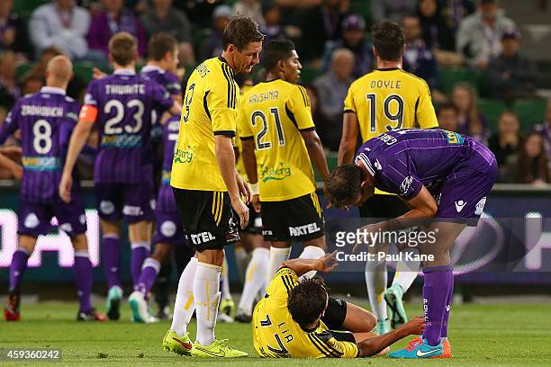 Richard Garcia of the Glory gestures to Vince Lia of the Phoenix as referee Lucien Laverdure issues a red card Ruben Zadkovich of the Glory during...
